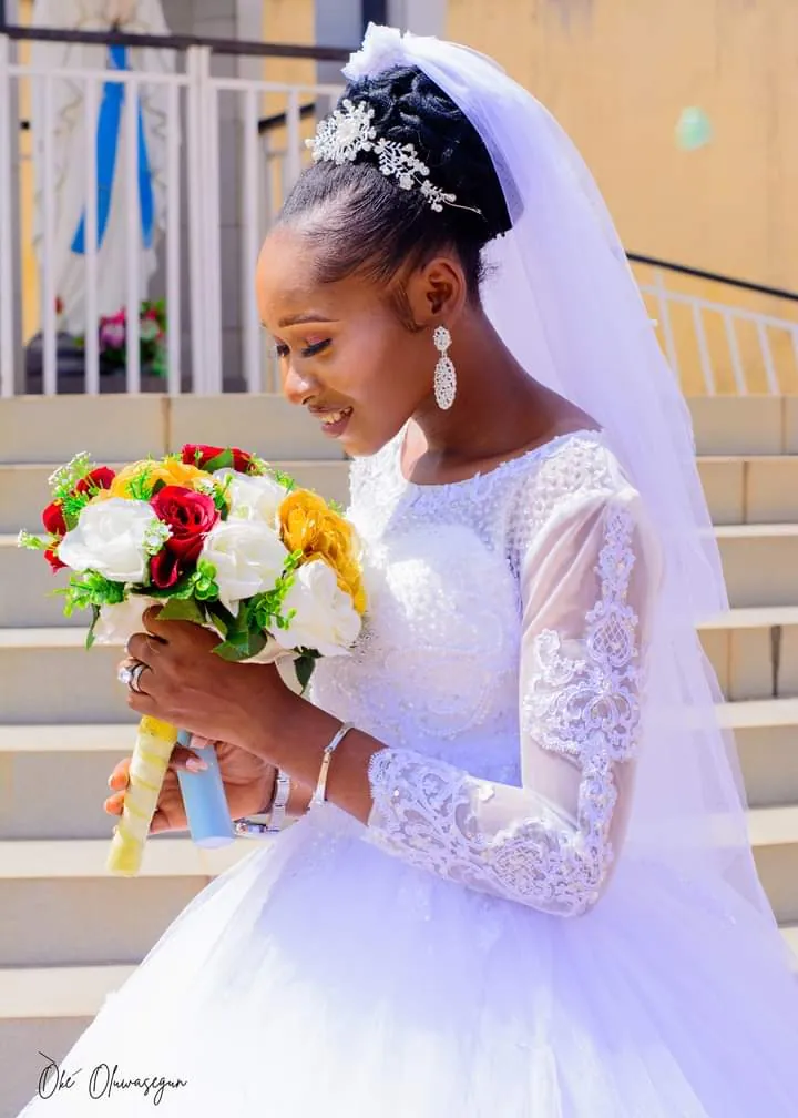 Bride with a red and yellow rose bouquet