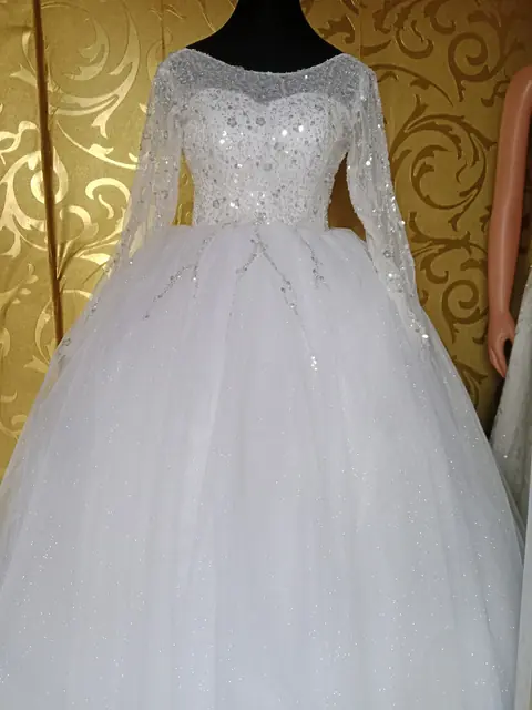 Off-white lace ball gown on a mannequin