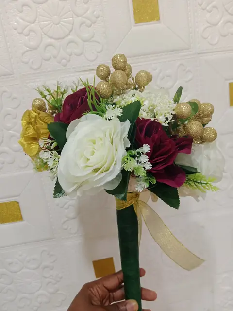 Burgundy and ivory bouquet with gold berries