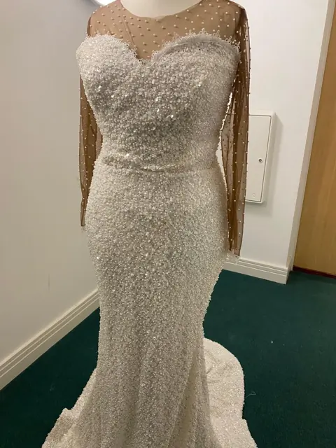 Pearl and sequin mermaid gown with sheer pearl-studded sleeves, made in the UK